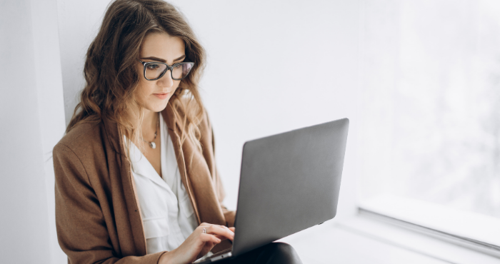 paralegal-researching-sqe-on-laptop