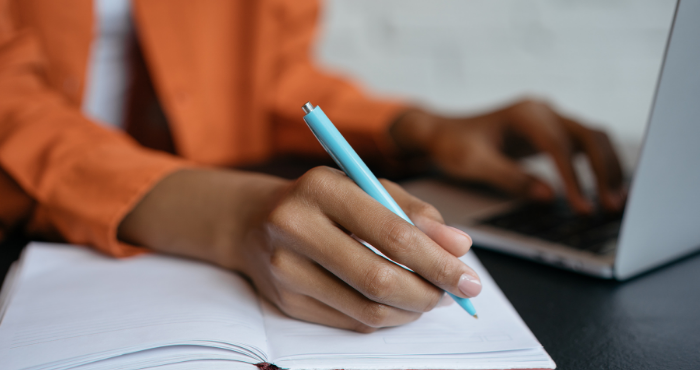woman-writing-legal-cv-notes