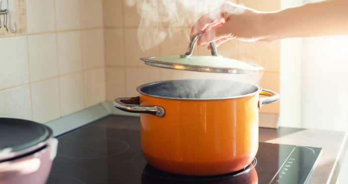 cooking-pot-person-making-dinner-on-hob