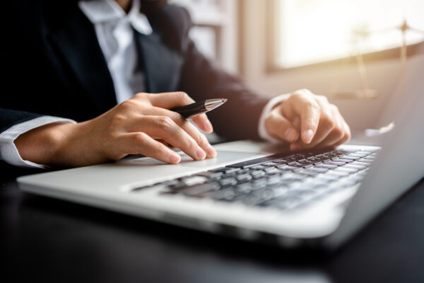 Close up of views female Lawyer or Business women working with l Close up of views female Lawyer or Business women working with laptop at a law firm, Justice and law concept.