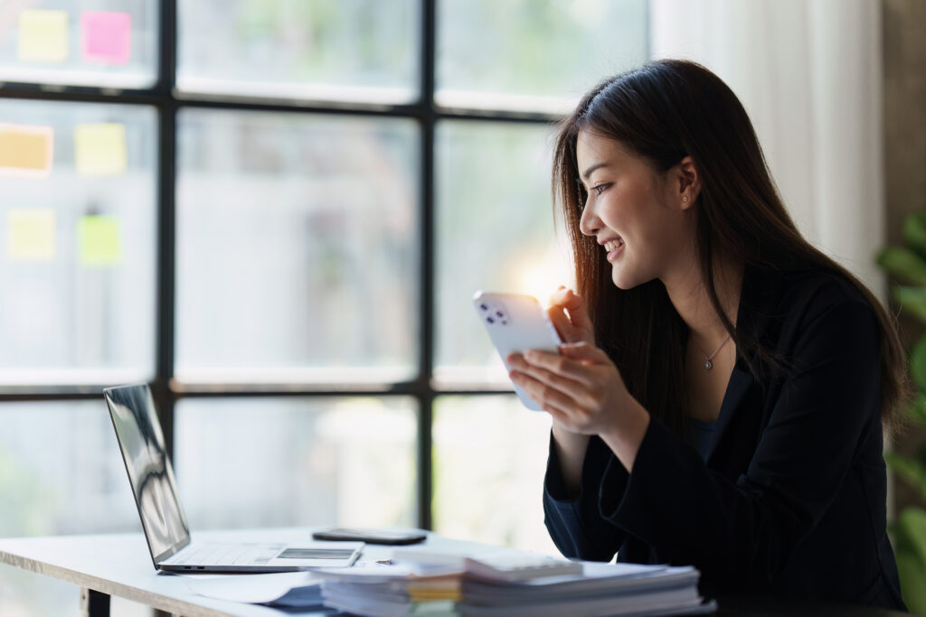 Beautiful Businesswoman completes KYC using an online banking program in order to open a digital savings account. The definition of cyber security Beautiful Businesswoman completes KYC using an online banking program in order to open a digital savings account. The definition of cyber security.