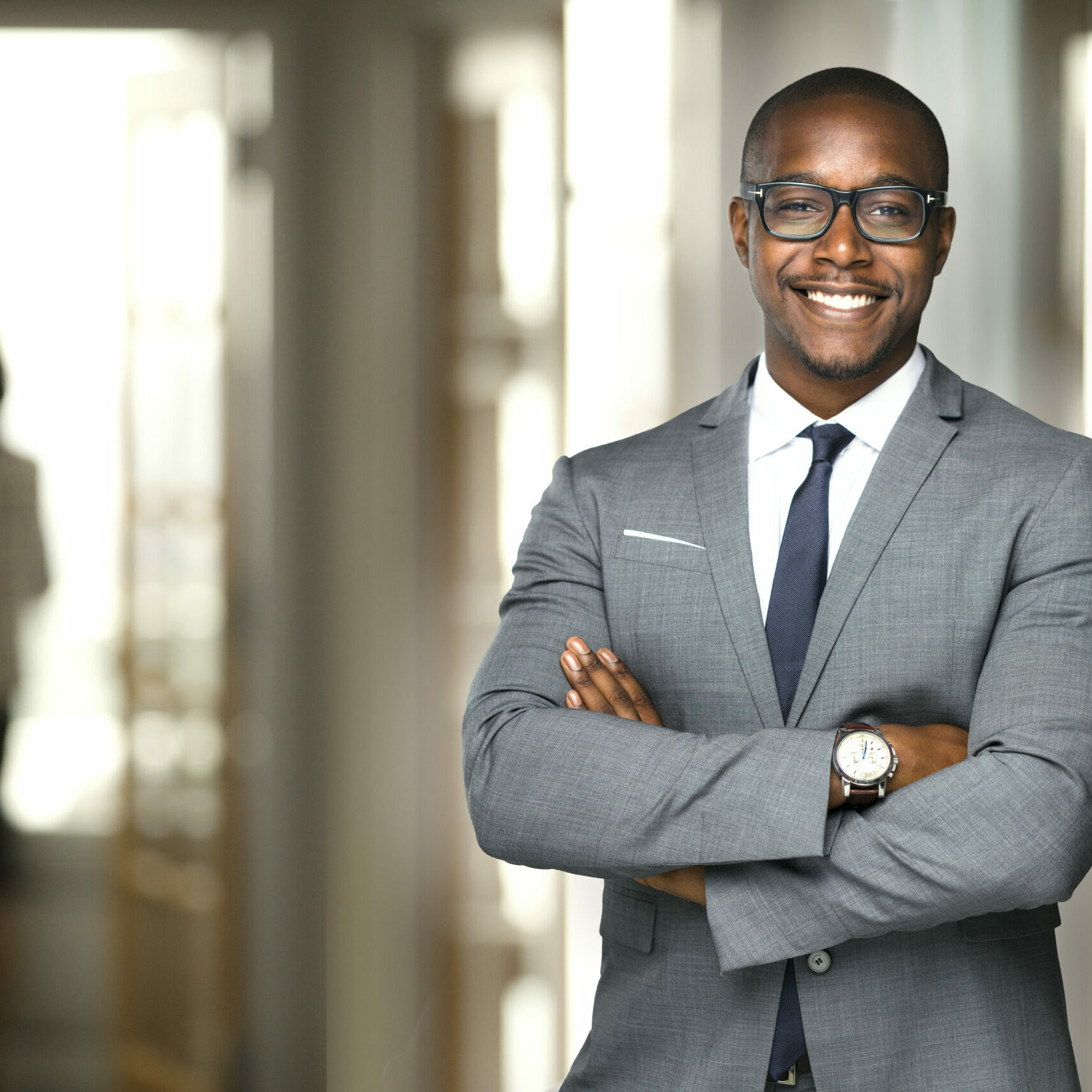 Handsome cheerful african american executive business man at the Handsome cheerful african american executive business man at the