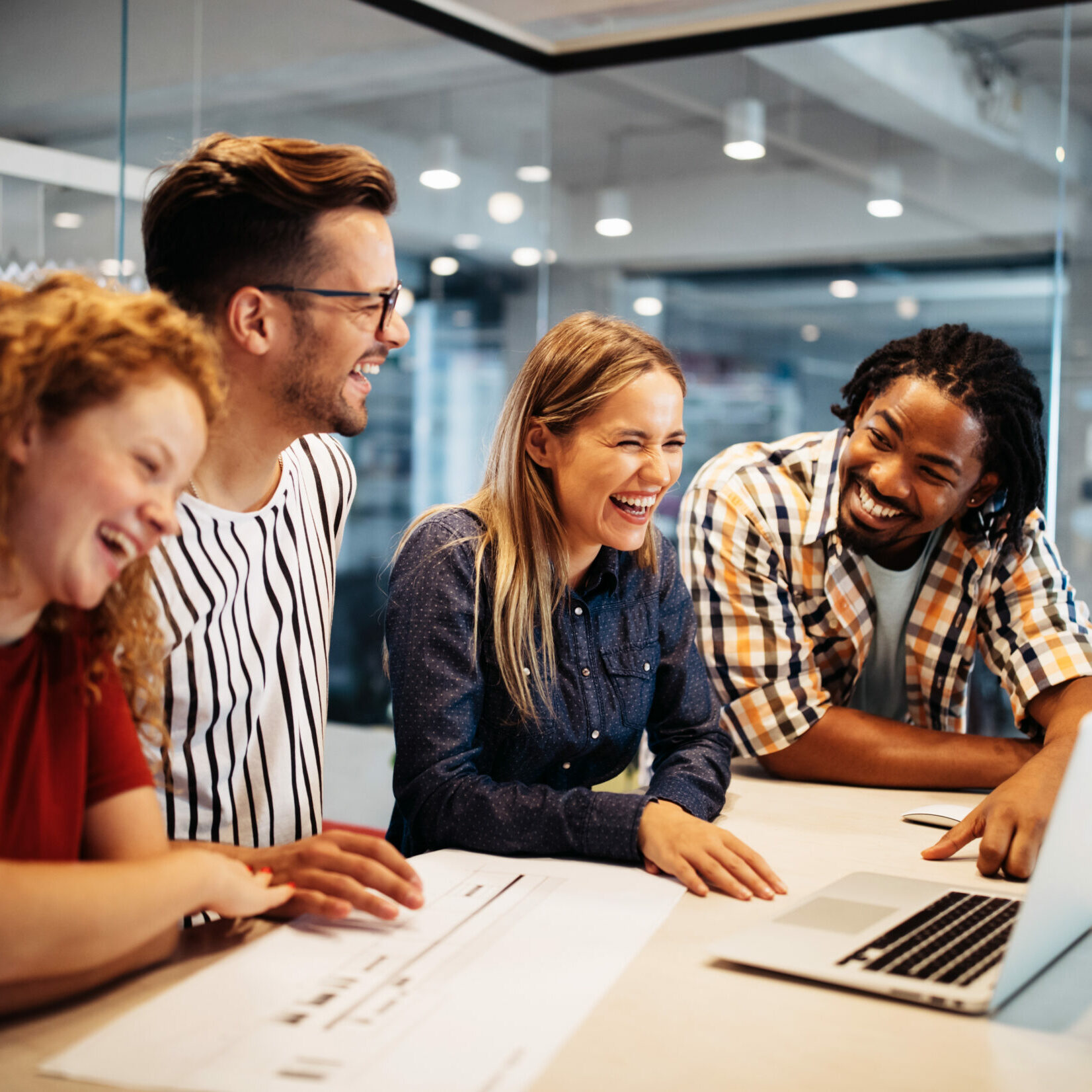 Happy creative designers, business people brainstorming in office Happy creative designers, business people brainstorming and working at workplace