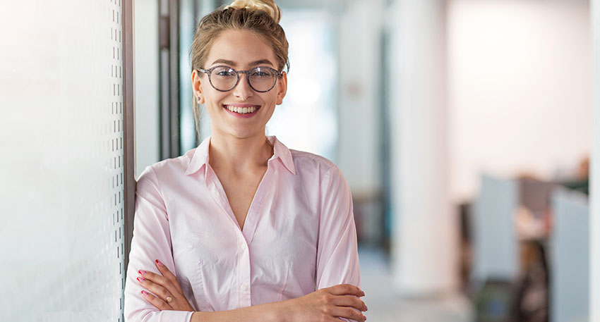 intern-4-1 A female lawyer stands confidently at a law firm